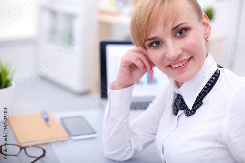Wallpaper Mural Portrait of businesswoman sitting at desk Torontodigital.ca