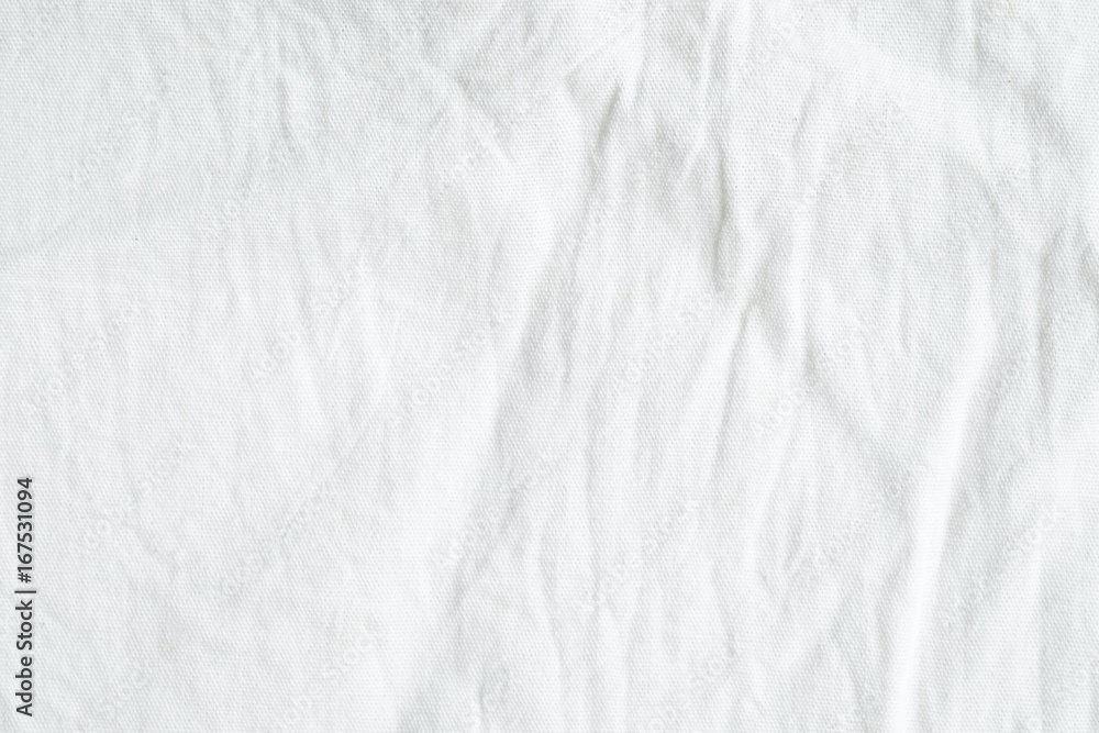 Wrinkled white cotton fabric texture background, wallpaper Stock Photo