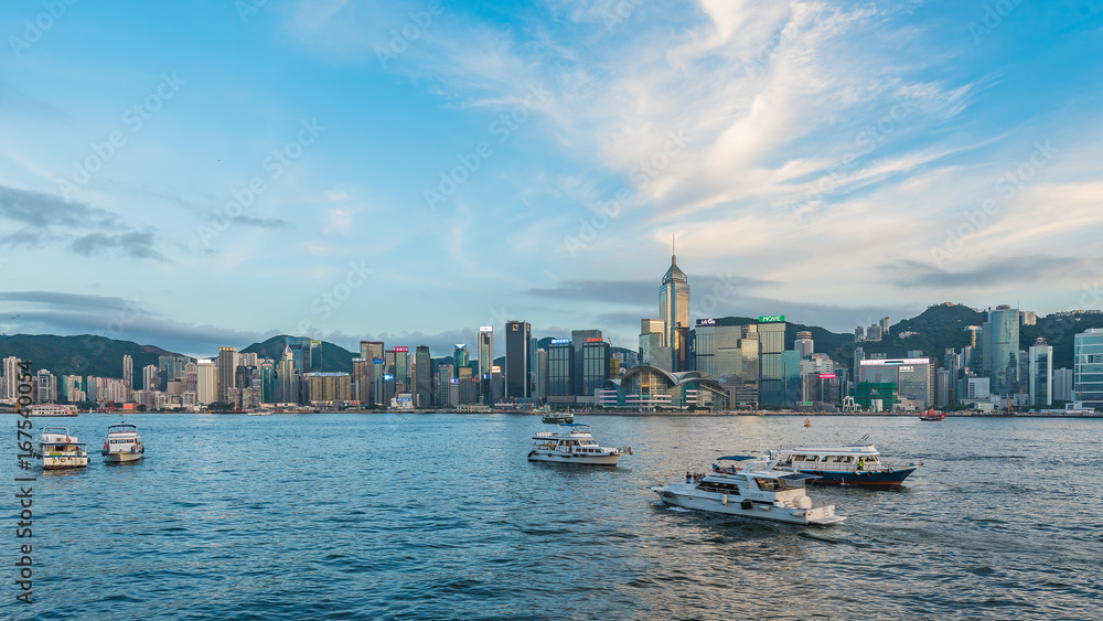 VICTORIA HARBOUR, HONG KONG - AUGUST 4, 2017 : View from Kowloon toward the Victoria Harbour in the late evening