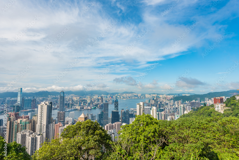 VICTORIA PEAK, HONG KONG - AUGUST 4, 2017 : View from Victoria Peak toward Victoria Harbour and Kowloon