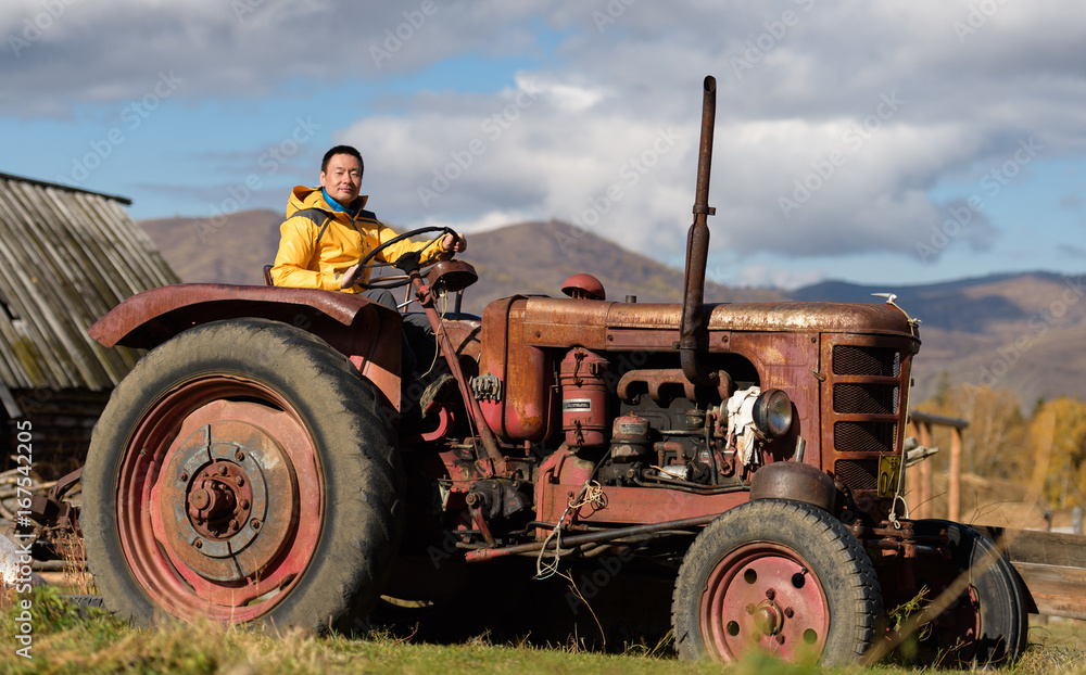 A man drives a tractor