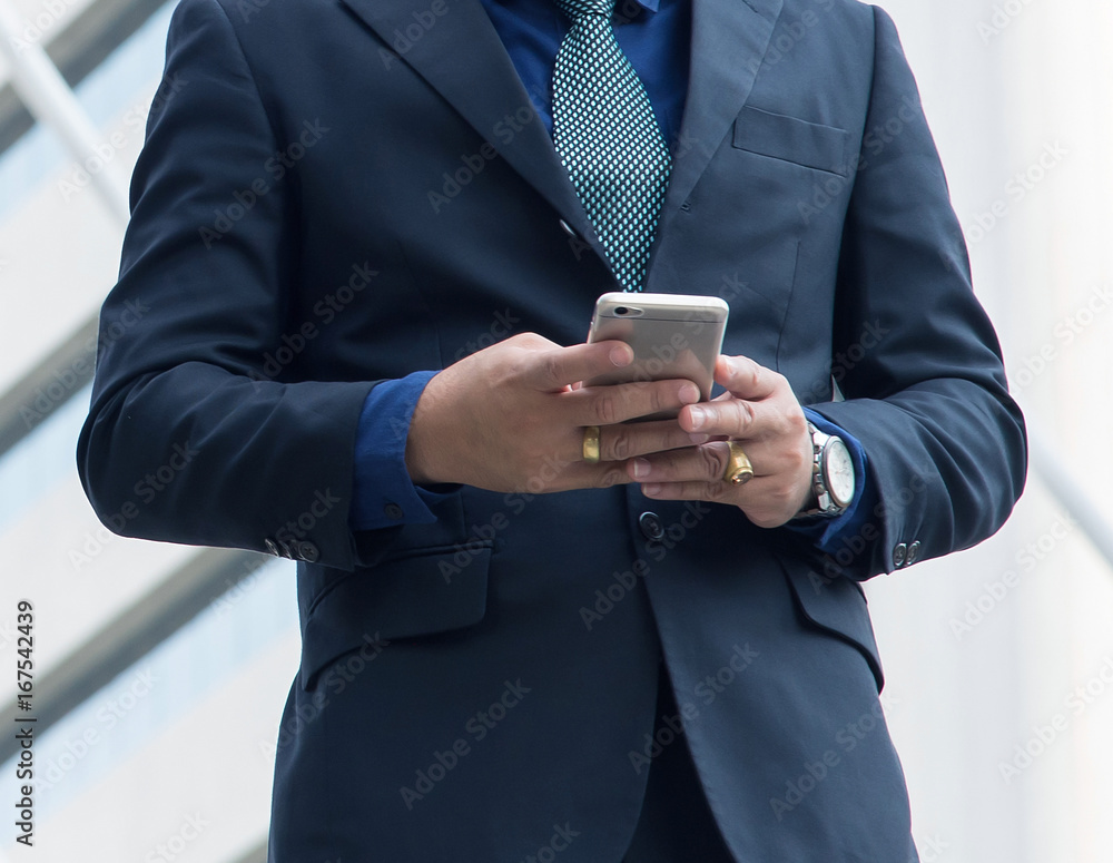 businessman using the mobile phone, use for business and conference or seminar background. businessman using the mobile phone, use for business and conference or seminar background.