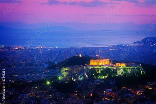 cityscape of Athens with illuminated Acropolis hill and Pathenon temple at night, Greece, retro toned