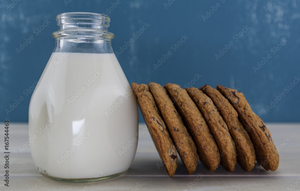 Six Cookies Leaning Against Jar of Milk Six Cookies Leaning Against Jar of Milk
