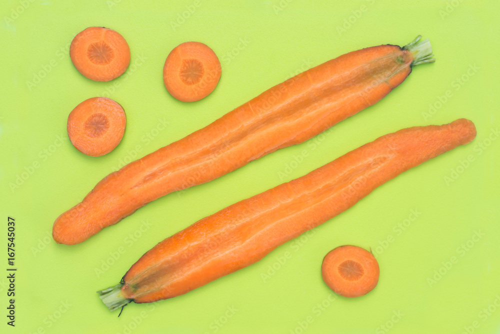 slices of carrot on green plastic cutting board slices of carrot on green plastic cutting board