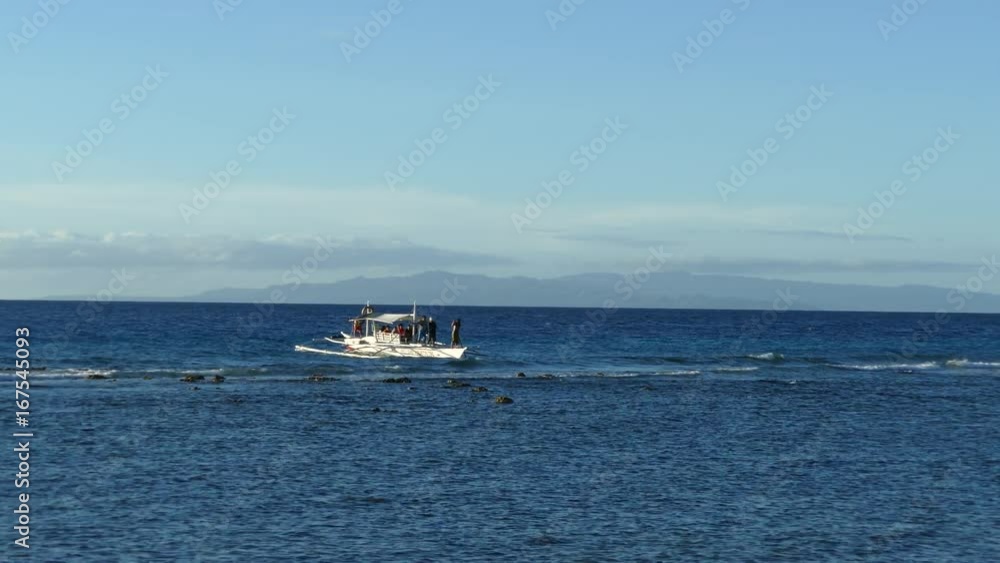 Catamaran Boat arrives at Balicasag Island in Bohol the Philippines Catamaran Boat arrives at Balicasag Island in Bohol the Philippines
