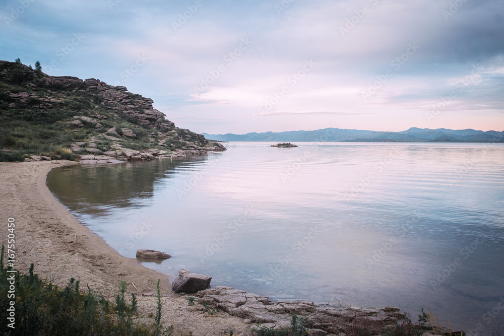 View on the beach Bukhtarma reservoir on sunset, Bukhtarma Reservoir, East Kazakhstan View on the beach Bukhtarma reservoir on sunset, Bukhtarma Reservoir, East Kazakhstan