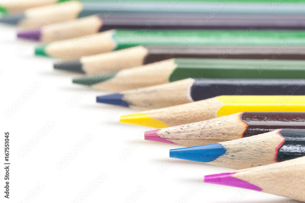 Colorful set of wooden pencil crayons with clear space for ideal on the white background,creative tool for kids Colorful set of wooden pencil crayons with clear space for ideal on the white background,creative tool for kids