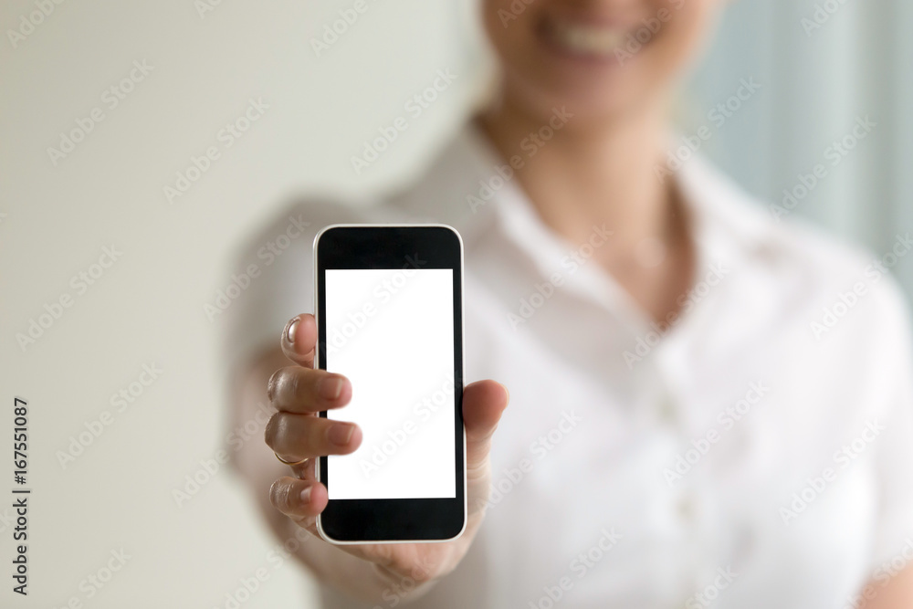 Woman holding smartphone in hands with mock up empty blank screen for mobile ads, place for advertising business applications and web services, phone display responsive design, close up, copy space Woman holding smartphone in hands with mock up empty blank screen for mobile ads, place for advertising business applications and web services, phone display responsive design, close up, copy space