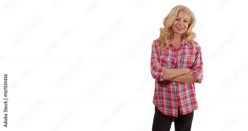 Cheerful Caucasian woman in flannel shirt smiling at camera on white background with copyspace. Proud farmer smiling with arms crossed in studio with copy space. 4k Cheerful Caucasian woman in flannel shirt smiling at camera on white background with copyspace. Proud farmer smiling with arms crossed in studio with copy space. 4k