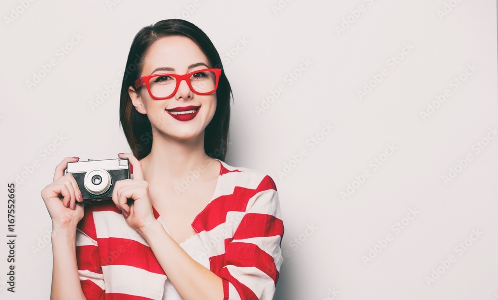 young smiling woman with retro camera young smiling woman with retro camera