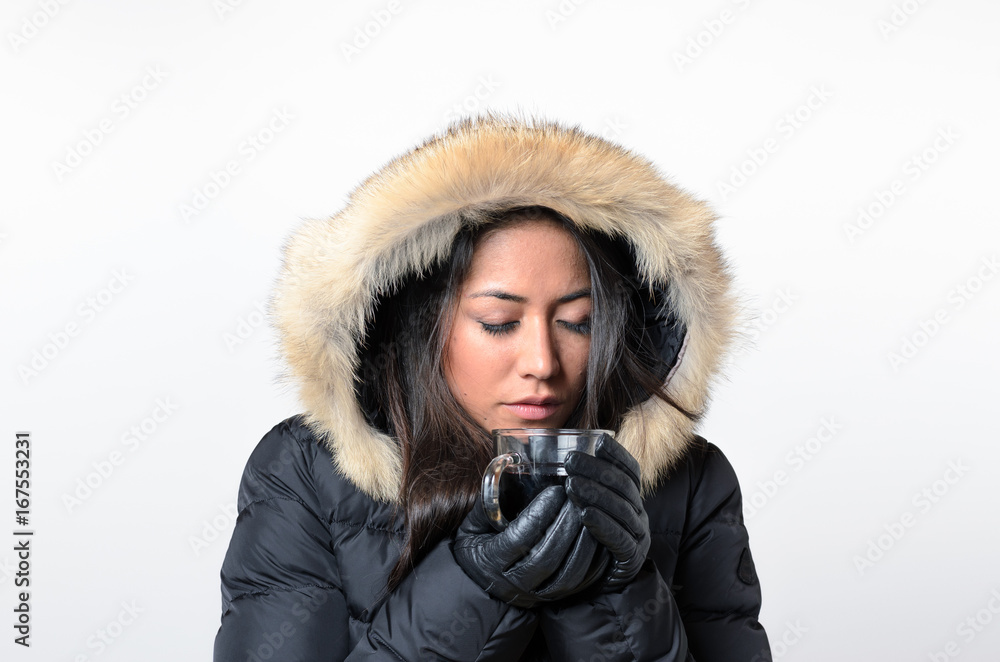 Woman wearing winter cap drinking hot beverage Woman wearing winter cap drinking hot beverage