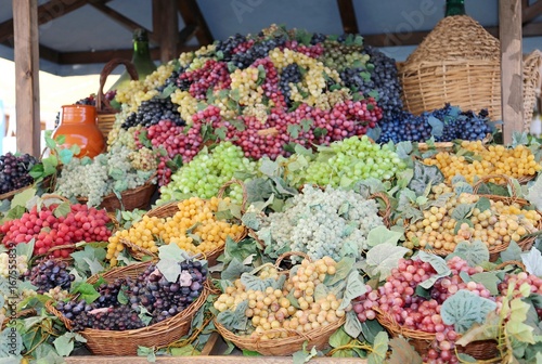 Billede på lærred baskets of ripe grapes and a carboy in fall