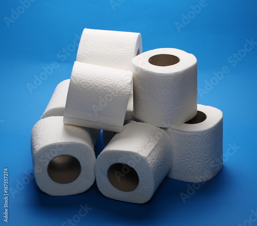 Toilet paper rolls isolated on blue background