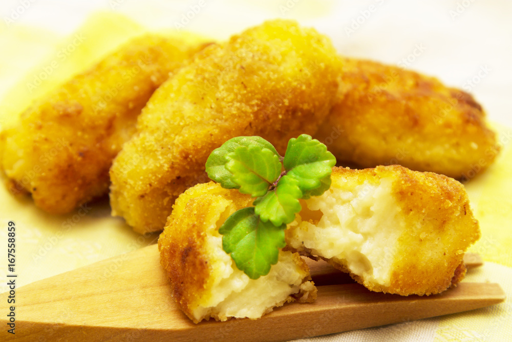 Stuffed croquettes on wooden fork Stuffed croquettes on wooden fork