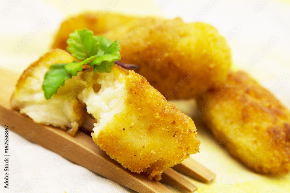 Stuffed croquettes on wooden fork Stuffed croquettes on wooden fork