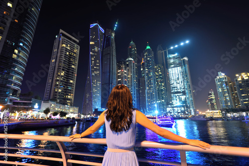 Photography Asian woman looking the cityscape of Dubai