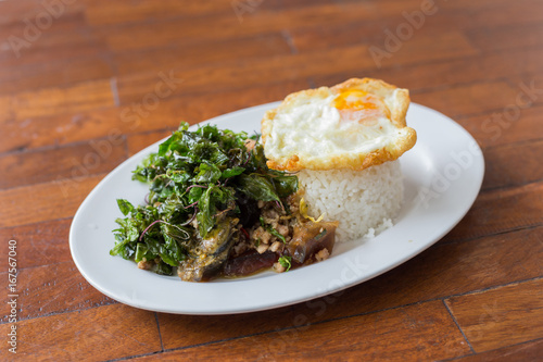 crispy basil herb pork and egg  with fried egg photo