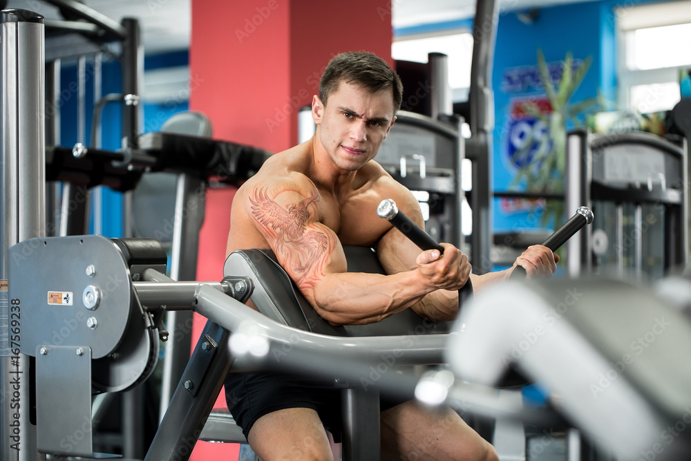 Exercise For Biceps. Young Bodybuilder Doing Heavy Weight Exercise For Biceps Exercise For Biceps. Young Bodybuilder Doing Heavy Weight Exercise For Biceps