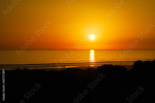 Silhouettes at sunset on the beach of La Barrosa  Sancti Petri  Cadiz  Spain