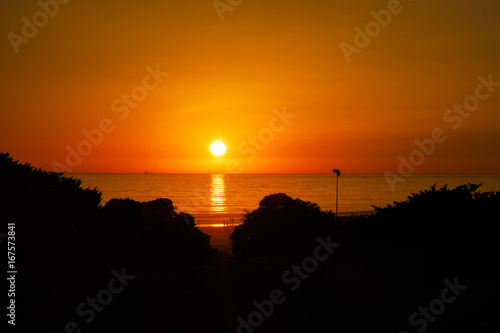 Silhouettes at sunset on the beach of La Barrosa  Sancti Petri  Cadiz  Spain