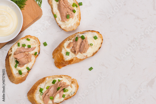Bruschetta. Sandwich tuna fish salad on wooden background