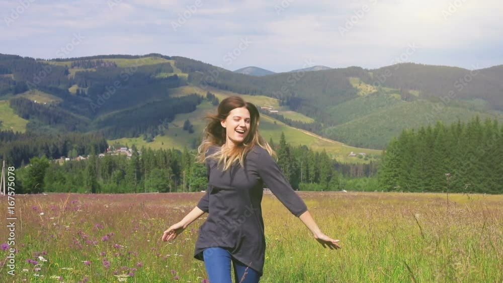 Girl young woman running jumping having fun mountains flowers grass beautiful cheerful satisfied happy leisure laughing smile amazing landscape summer weekend holiday loving nature therapy carefree Girl young woman running jumping having fun mountains flowers grass beautiful cheerful satisfied happy leisure laughing smile amazing landscape summer weekend holiday loving nature therapy carefree