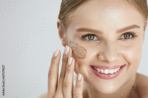 Face Skin Scrub. Smiling Female Applying Scrub On Face Skin