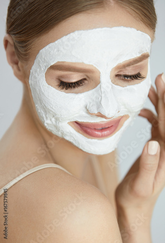 Skin Care Mask. Close Up Of Woman With White Face Mask