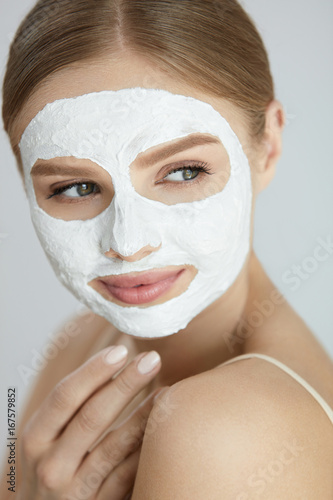 Skin Care Mask. Close Up Of Woman With White Face Mask