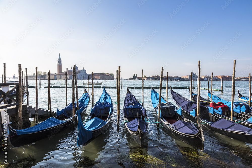 View of the Cathedral of San Giorgio Maggiore, the Venetian lagoon and gondolas from the San Marco Square, Venice, Italy