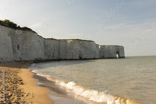 Sea view of waves with Kingsbay Sea Arch in the background photo