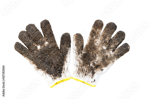 Dirty gloves with clay soil after gardening on white isolated background