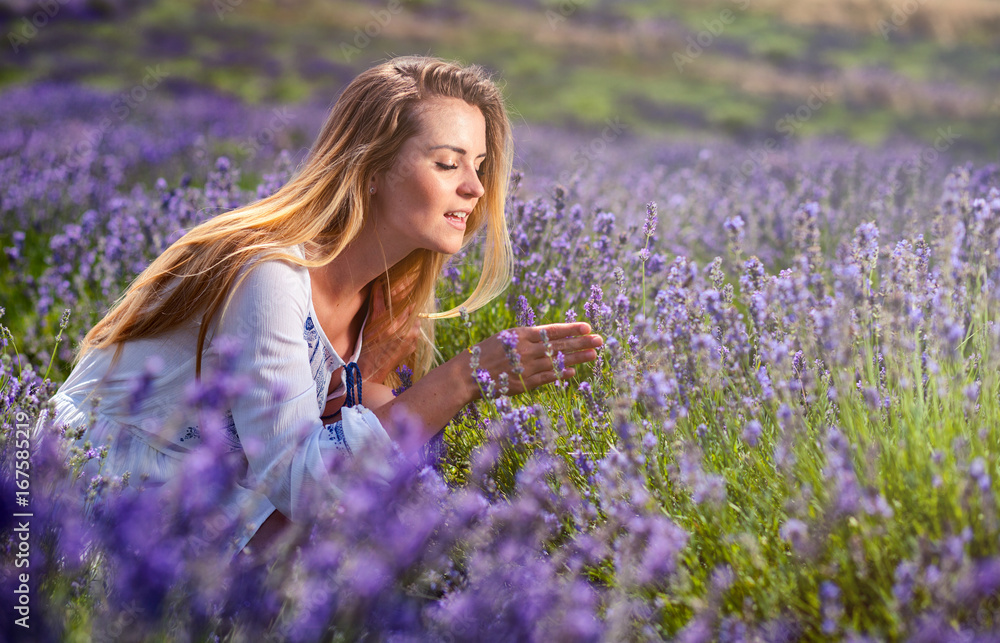 Lovely cute woman in lavender field at sunny day freedom concept Lovely cute woman in lavender field at sunny day freedom concept