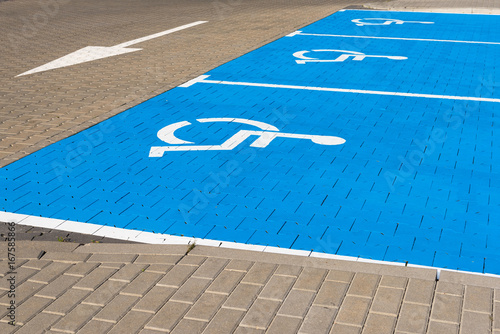Disabled parking sign on the street in Poland. Wheelchair logo.