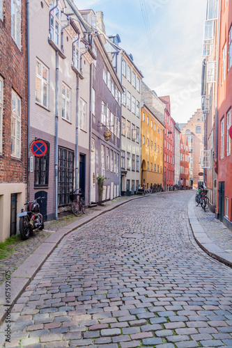 COPENHAGEN, DENMARK - AUGUST 26, 2016: Cobbled street in the center of Copenhagen, Denmark