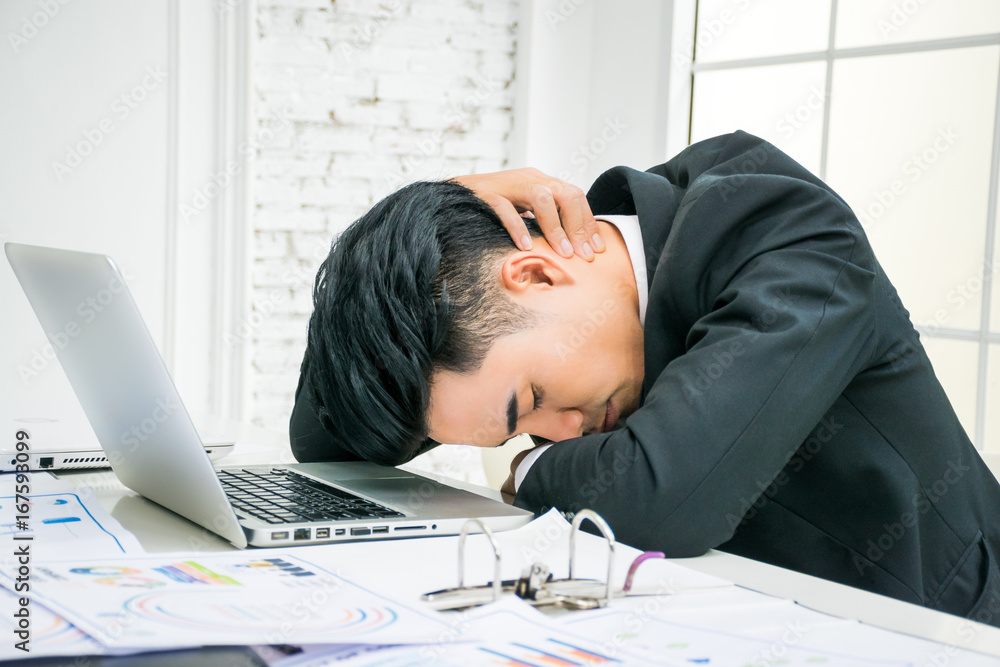 Tired businessman falling asleep at the office Tired businessman falling asleep at the office