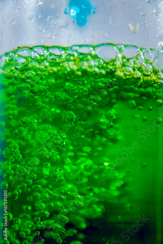 Laboratory glassware with colored liquid.