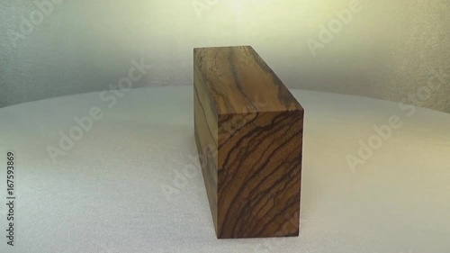 Rotating the block of wood Zebrano. Zebrawood. photo