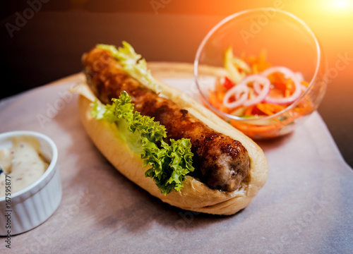 Grilled chicken seekh kebab with fresh bun and cheese.