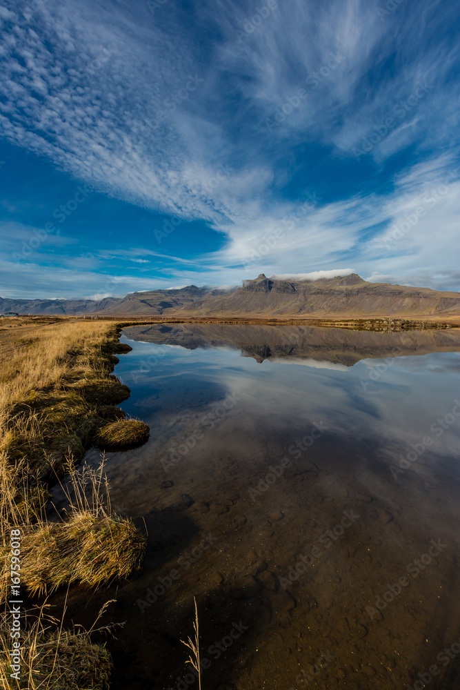 Fototapeta premium Reflecting the clouds on a still day, Iceland