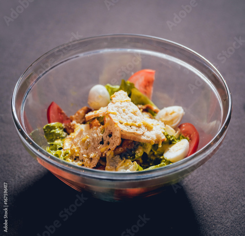 Leaf vegetable salad with olives and cheese feta photo