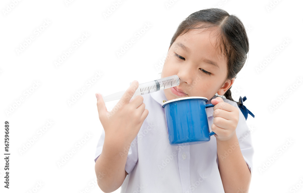 asian student girl flushing her nose with syringe and saline isolated asian student girl flushing her nose with syringe and saline isolated