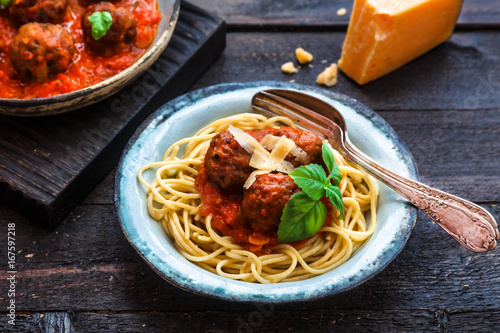 Itallian spaghetti and meatballs and parmegano for dinner, comfort food, close view photo