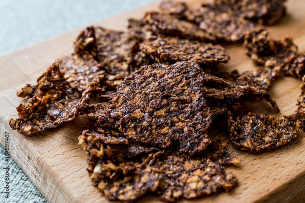 Apple and Cinnamon Chips on wooden surface.