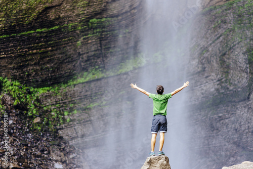 Tourist enjoys the Gocta waterfall in nothern peru photo