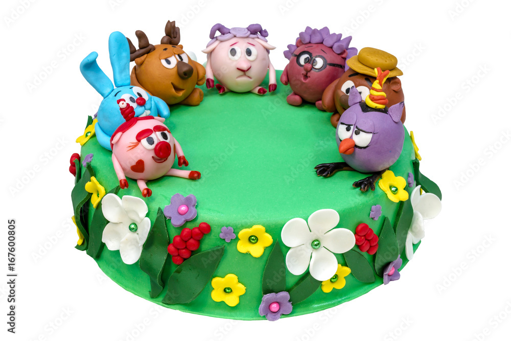 Fototapeta premium Cake with smeshariki and flowers from mastic isolated on white background