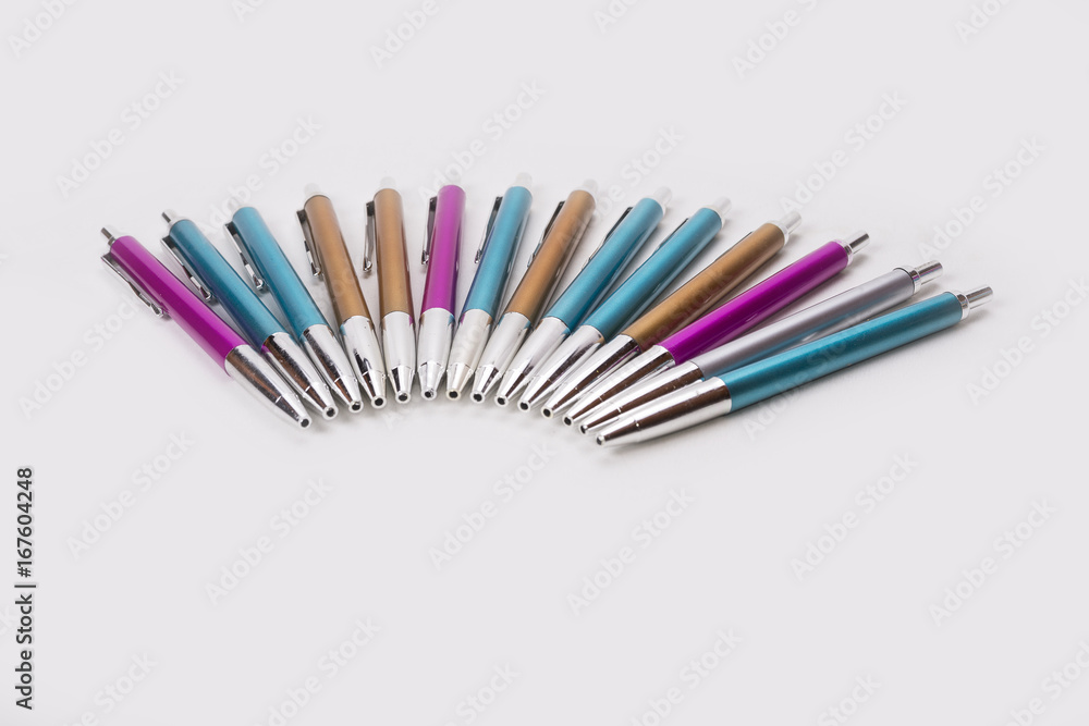 Blue pink and brown ballpoint pens on white background Blue pink and brown ballpoint pens on white background