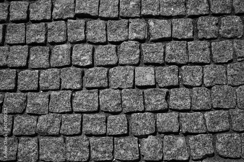 the stone pavement. Pavement of cobblestones. Background. the texture of the stones, free the empty space
