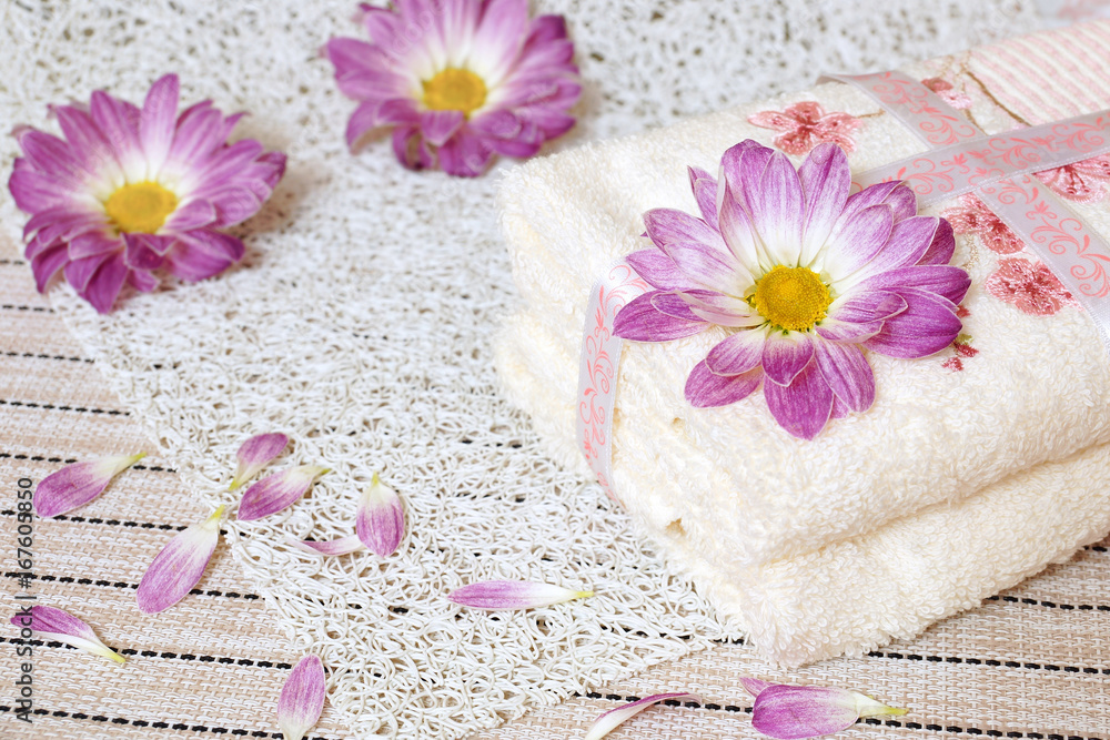Hotel towel. Two towels and flowers of chrysanthemums. Hotel towel. Two towels and flowers of chrysanthemums.